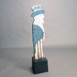 Folk Art Painted Sign in Form of Uncle Sam, mounted on a modern ebonized weighted base {Overall