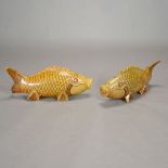 A Pair of Carved Stone Koi Fish Both with carved and painted features, the mottled yellowish-green
