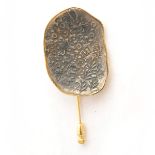 Silver Bracteate, 14k Yellow Gold Stickpin. Featuring one ovoid shaped silver bracteate measuring