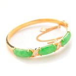 Jade, Diamond, 18k Yellow Gold Bracelet. Featuring three jadeite segments ranging in size from