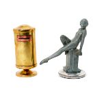 Brass Bank and an Art Nouveau Pewter Radiator Cap, in the form of a reclining nude {Height of figure