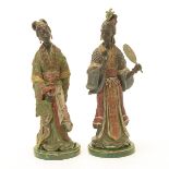 Pair of Continental Bronze Cold Painted Figures of Courtesans, on faux malachite bases {Height of