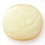 Jade, 14k Yellow Gold Brooch. Featuring one carved oval jade segment measuring approximately 43 x 48