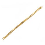 18k Yellow Gold "ID" Bracelet. The 18k yellow gold flat curb link measuring approximately 8 mm in