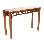 An Elmwood Side Table The slender rectangular table with latticework aprons featuring rings and '