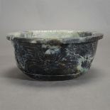 A Carved Green Hardstone Basin Carved to the exterior and rim with a floral motif.