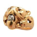 Diamond, Garnet, 10k Yellow Gold Lion Ring. Designed as the head of a lion, the mouth holding one