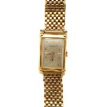 Movado 14k Yellow Gold Wristwatch. DIAL: Rectangle, silver, gold line and dot hour markers, black