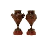 Pair of Bronze Urns on Marble Plinths