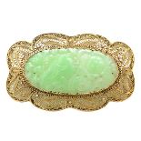 Jade, 14k Yellow Gold Brooch. Centering one carved and pierced jadeite plaque measuring