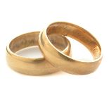 Collection of Two 18k Yellow Gold Bands. The matching 18k yellow gold wedding bands 5 mm and 6 mm in