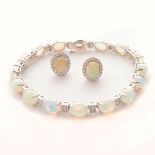 Opal, Diamond, 14k White Gold Jewelry Suite. Including a opal cabochon, diamond, 14k white gold 7