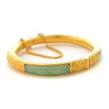 Jade, 24k Yellow Gold Bracelet. Composed of four jadeite segments, set in a 24k yellow gold engraved