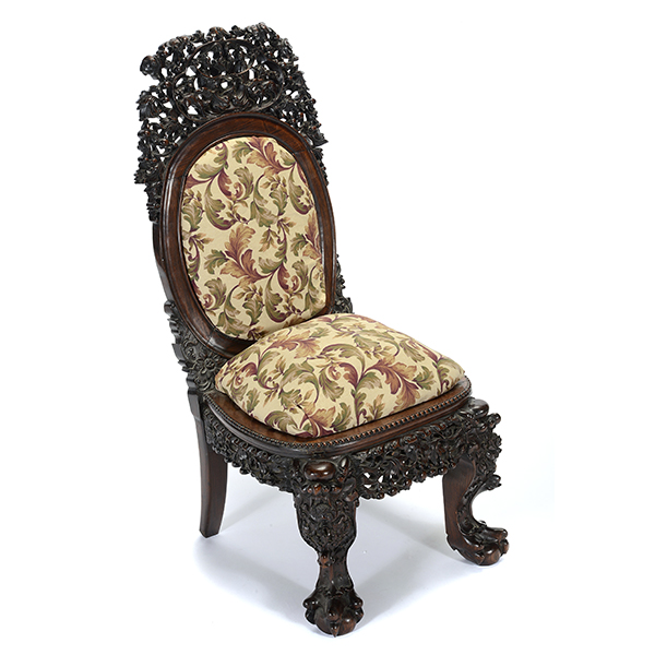 A Chinese Export Rosewood Side Chair Heavily carved in openwork with a pair of figures and deer