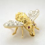 Diamond, Ruby, 18k Yellow Gold Bee Brooch. Designed as a bee, the wings set with twelve full-cut