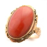 *Coral, 14k Yellow Gold Ring. Featuring one oval coral cabochon measuring approximately 19.8 x 13