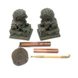 Three Decorative Asian Objects Comprising a pair of bronze Buddhist lions with bases, and a Japanese