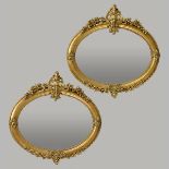 Pair of French Louis XVI Style Oval Gilded Mirrors