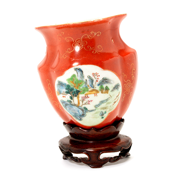 An Enameled Coral-Ground Wall Vase Painted with a landscape reserved against a coral-red ground