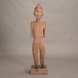 Toraja Carved Wood Tau Tau Figure of a Man, Shown standing with his arms at his side, his face