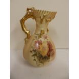 A Royal Worcester floral painted jug with gilt branchiform handle