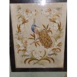 An embroidered silk panel depicting a peacock