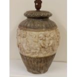 A relief moulded earthenware lamp base