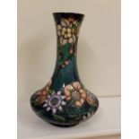 A boxed Moorcroft Carousel pattern vase