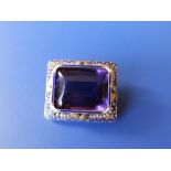 An amethyst set rectangular brooch set with seed pearls and enamel – the rectangular cut amethyst