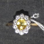 A yellow sapphire & diamond set cluster ring