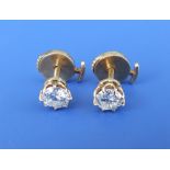 A pair of diamond stud earrings, each brilliant cut stone weighing approximately .50 carat, claw set