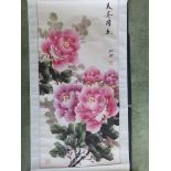 A 20thC Chinese signed colour printed scroll wall hanging depicting pink flowers, 37” x 18”