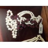 A long freshwater pearl necklace and a garnet necklace (2)