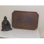 A bronze patinated spelter seated Chinese figure, 5.5” and a small signed wooden tray (2)