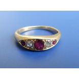 A five stone graduated ruby & diamond band ring