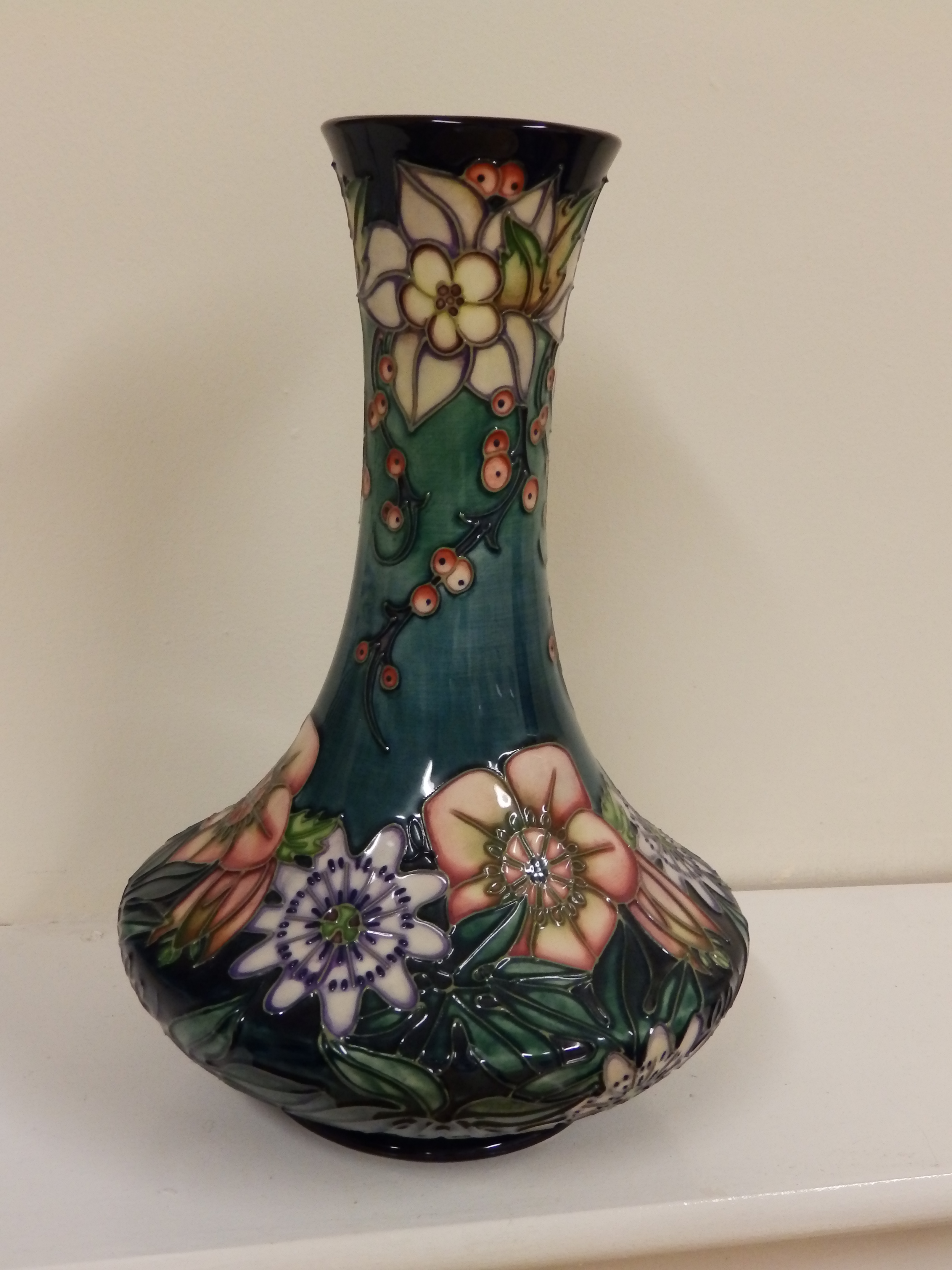 A boxed Moorcroft Carousel pattern vase to match previous lot