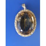 An oval citrine set pendant/brooch, with presentation inscription ' EHB , EJB 1872', 1.6”
