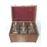 A 19thC Dutch mahogany decanter case, containing six square bottles with gilded shoulders11.75”