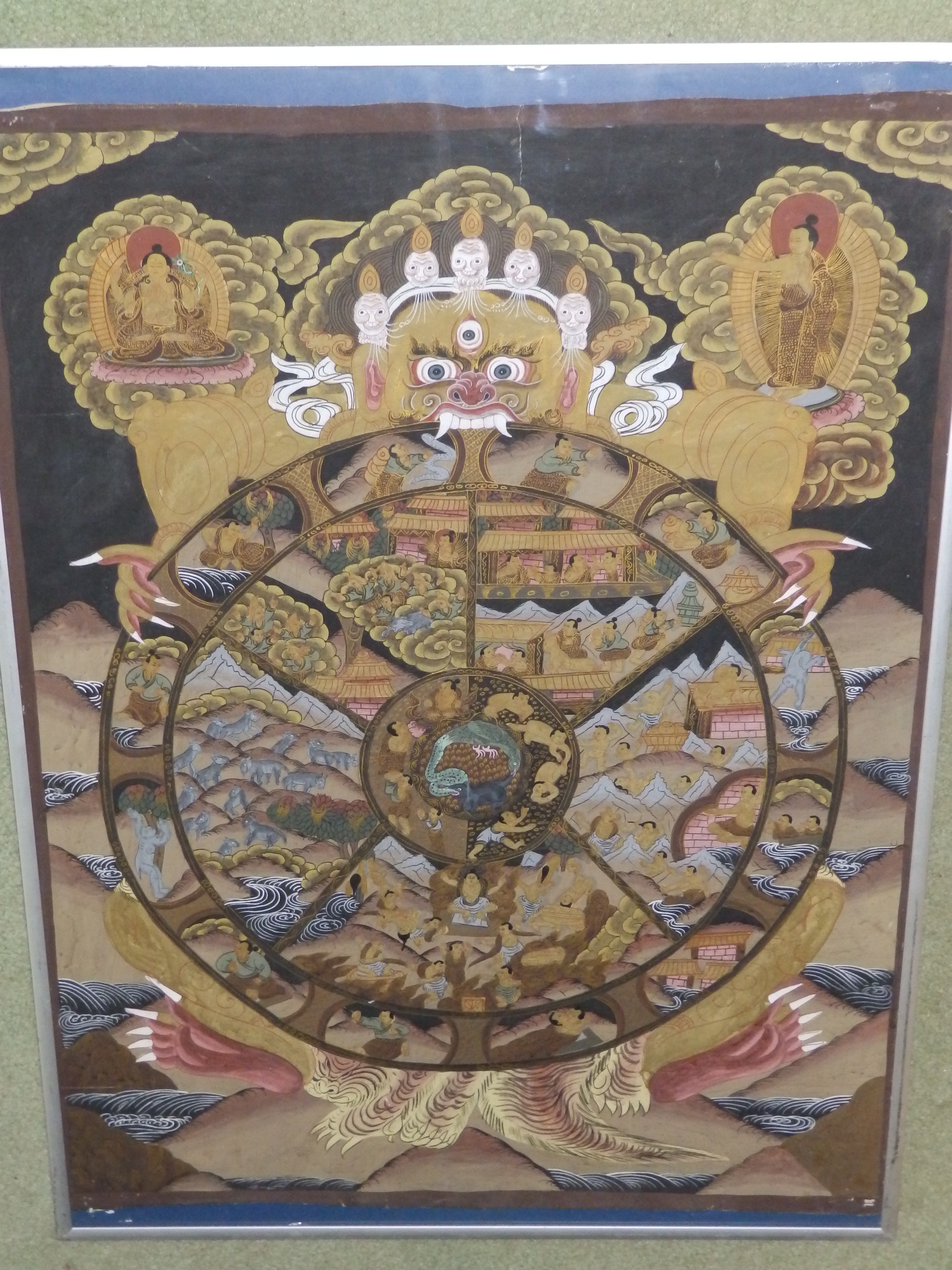 A Tibetan thangka painting in bodycolour with gold, 27” x 20”