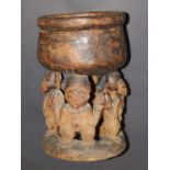 A carved African figural bowl
