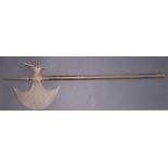 A 19thC Indo-Persian crescent headed axe with metal haft, 29” overall