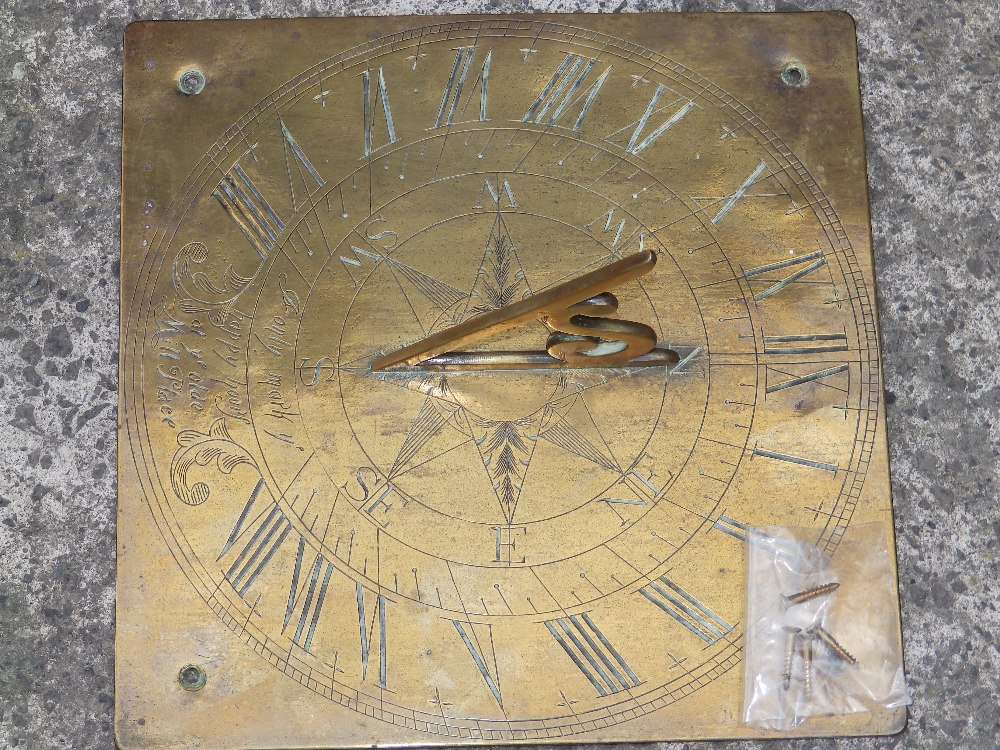 A 19thC brass sundial - 'I only mark ye happy hours at ye olde Mill Place'