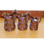 A set of three Victorian graduated copper lustre jugs
