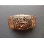 A Napoleonic coquilla nut snuff box, carved in high relief and undercut to depict European figures