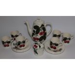 A 14 piece Plichta cherry pattern coffee set – two cups cracked