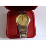 A gent's bi-metal Omega Seamaster quartz wrist watch with date indicator together with box