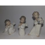 Three small Lladro angels