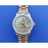 A boxed lady's diamond set 18ct gold Rolex Datejust wrist watch, having diamond dot numerals and