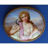 A Victorian oval painted porcelain brooch depicting Ruth with a sickle, 2.5”