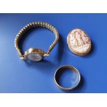 A lady's gold wrist watch, a wedding band and a cameo brooch (3